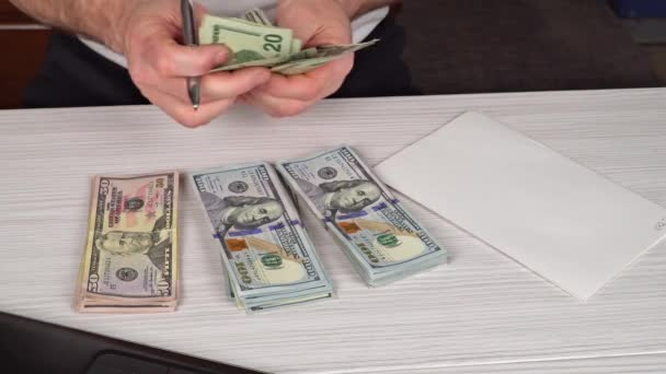 depositphotos_185415730-stock-video-man-counting-moneyman-in-business